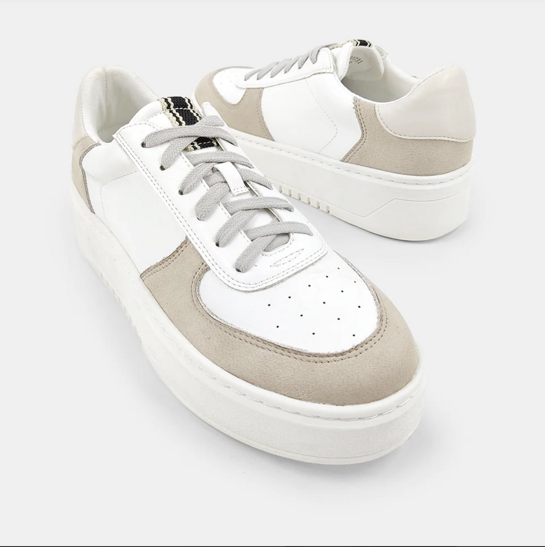 Top view of a white and taupe shoe with a platform sole and laces.