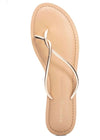 Top view of a shiney gold sandal with a twisted toe strap and a padded sole. 