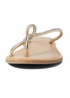 Front view of a shiney gold sandal with a twisted toe strap and a padded sole. 