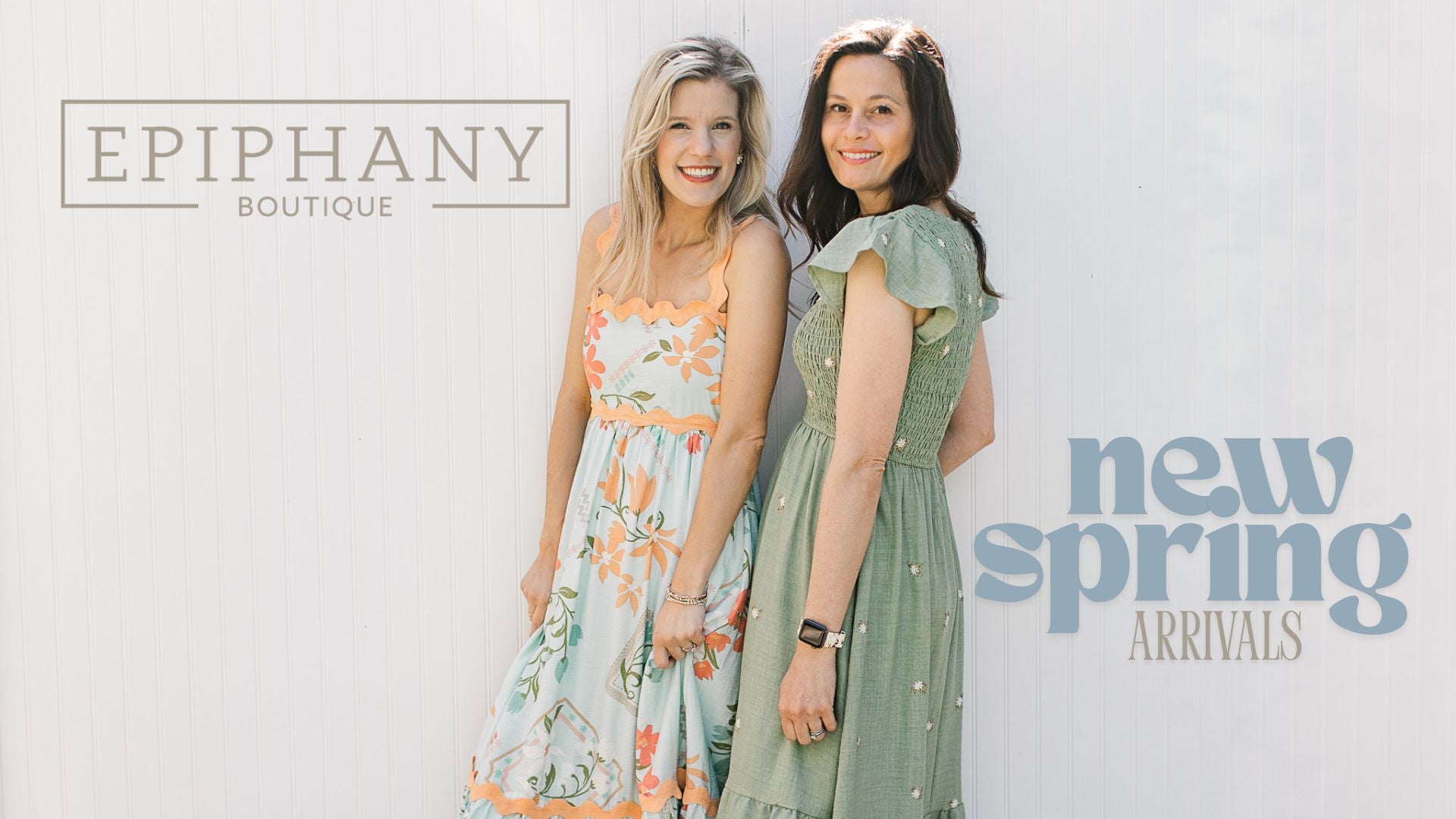 Brunette and blonde models wearing spring dresses with spring arrival banner.