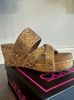 Outside view of cork wedge shoes with gold bead upper, cushioned footbed and 3 inch heel.