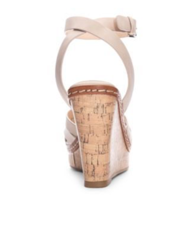 Back view of 4.25 inch wedge on a sand color sandal with a round toe, buckle closure and woven top. 