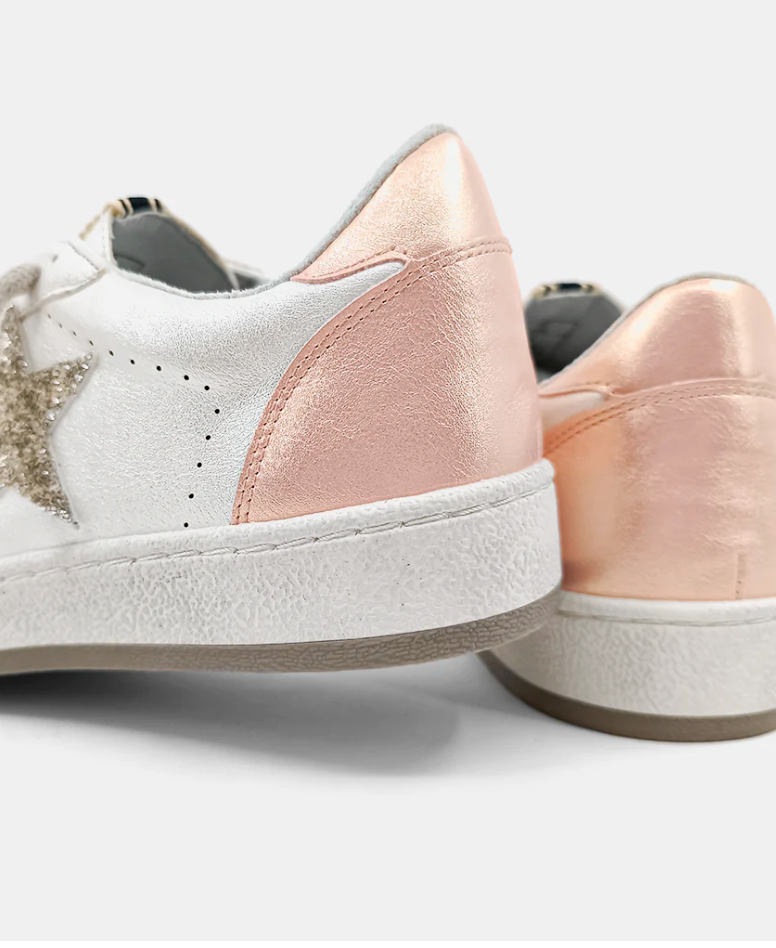 Back view of pearly pink accent on a sneaker with a pearly faux leather and silver glitter star. 