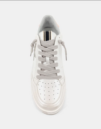 Top view of a retro sneaker with a pearly faux leather, silver glitter star and short knot lace. 
