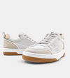 View of a set of cream sneaker with a taupe upper, brown sole and mesh detail.  