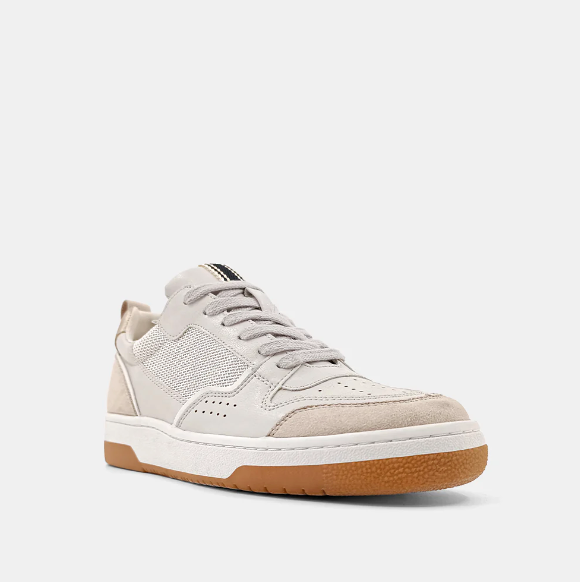 Front/outside view of a cream sneaker with a taupe upper, brown sole and mesh detail.  