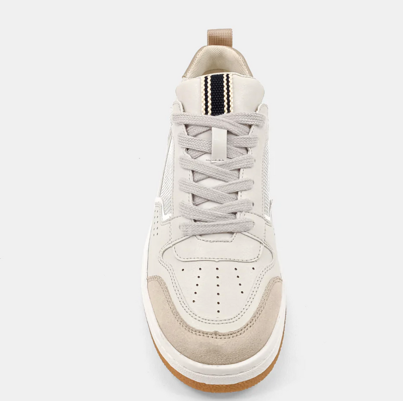 Top view of a cream sneaker with a taupe upper, brown sole and black and cream tongue detail. 