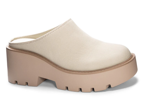 Outside view of a cream colored platform mule with a round toe and a backless design. 