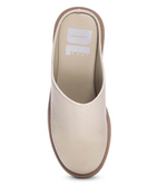 Top view of a cream colored platform mule with a round toe and a backless design. 
