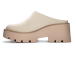 Inside view of a cream colored platform mule with a round toe and a backless design. 