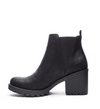 Inside view of a black bootie with a lug sole and a chunky 3” platform heel. 