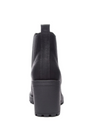 Back view of a black bootie with a lug sole and a chunky 3” platform heel. 