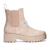 side view of natural colored pull on chelsea bootie on white background