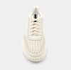 Top view of cream sneakers made of faux leather with a paneled construction and a topstitch trim.
