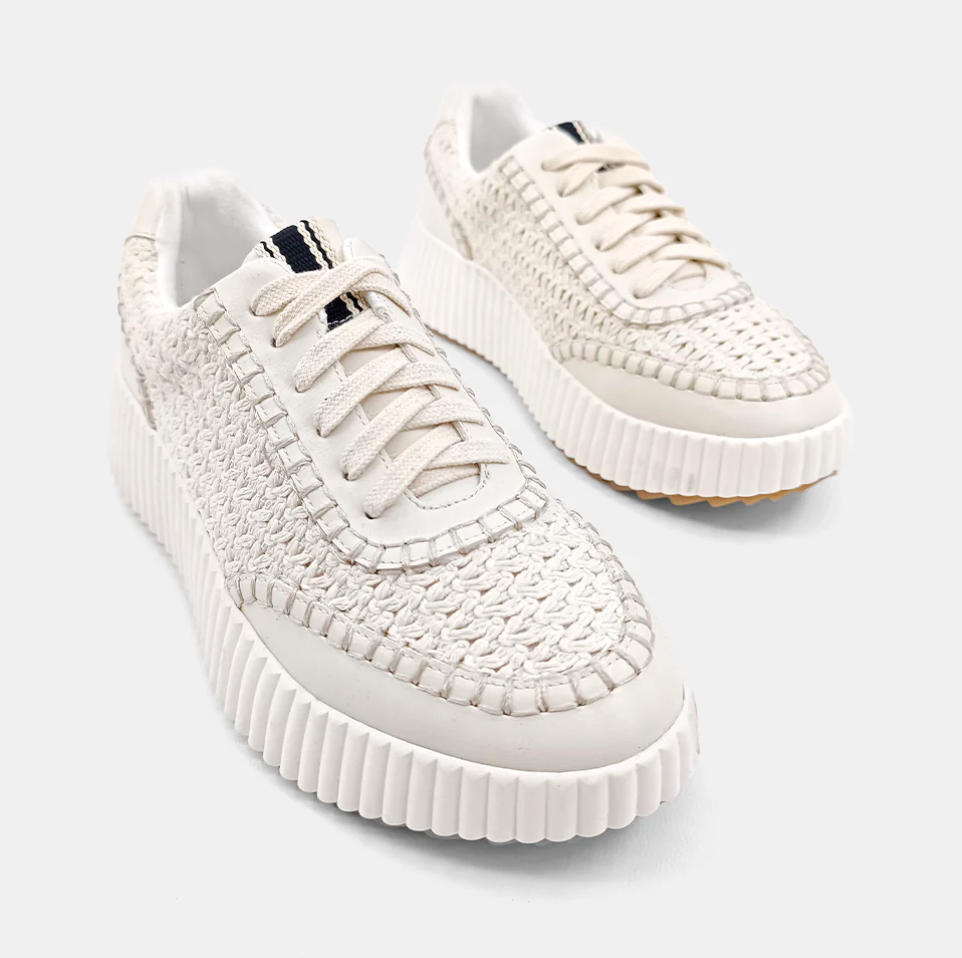 Chunky cream sneakers comprised of a faux leather with a paneled construction and a topstitch trim. 