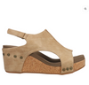Outside view of faux leather wedge sandals with sling back adjustable strap and a cushioned footbed.