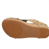 Bottom view of faux leather wedge sandals with sling back adjustable strap and a cushioned footbed.