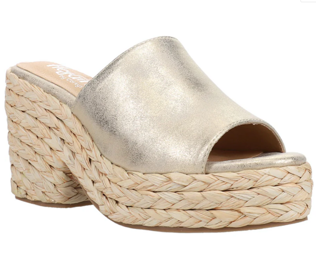 Front view of a muted gold upper on a wedge rope heel with a padded foot pad.