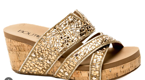 Side view of cork wedge shoes with gold bead upper, cushioned footbed and 3 inch heel. 
