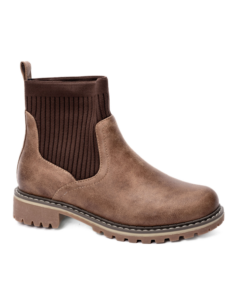 Side view of a medium brown bootie with a round toe, knit sweater shaft and  1.5” stockman heel.