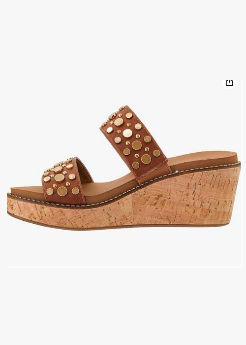 Inside view of a brown double strap 2 3/4”wedge with metal embellishments and slip-on design. 