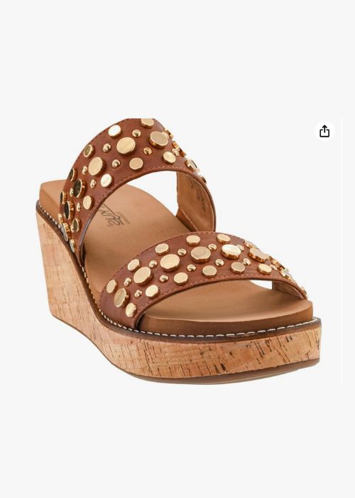 Front view of a brown double strap 2 3/4”wedge with metal embellishments and slip-on design. 