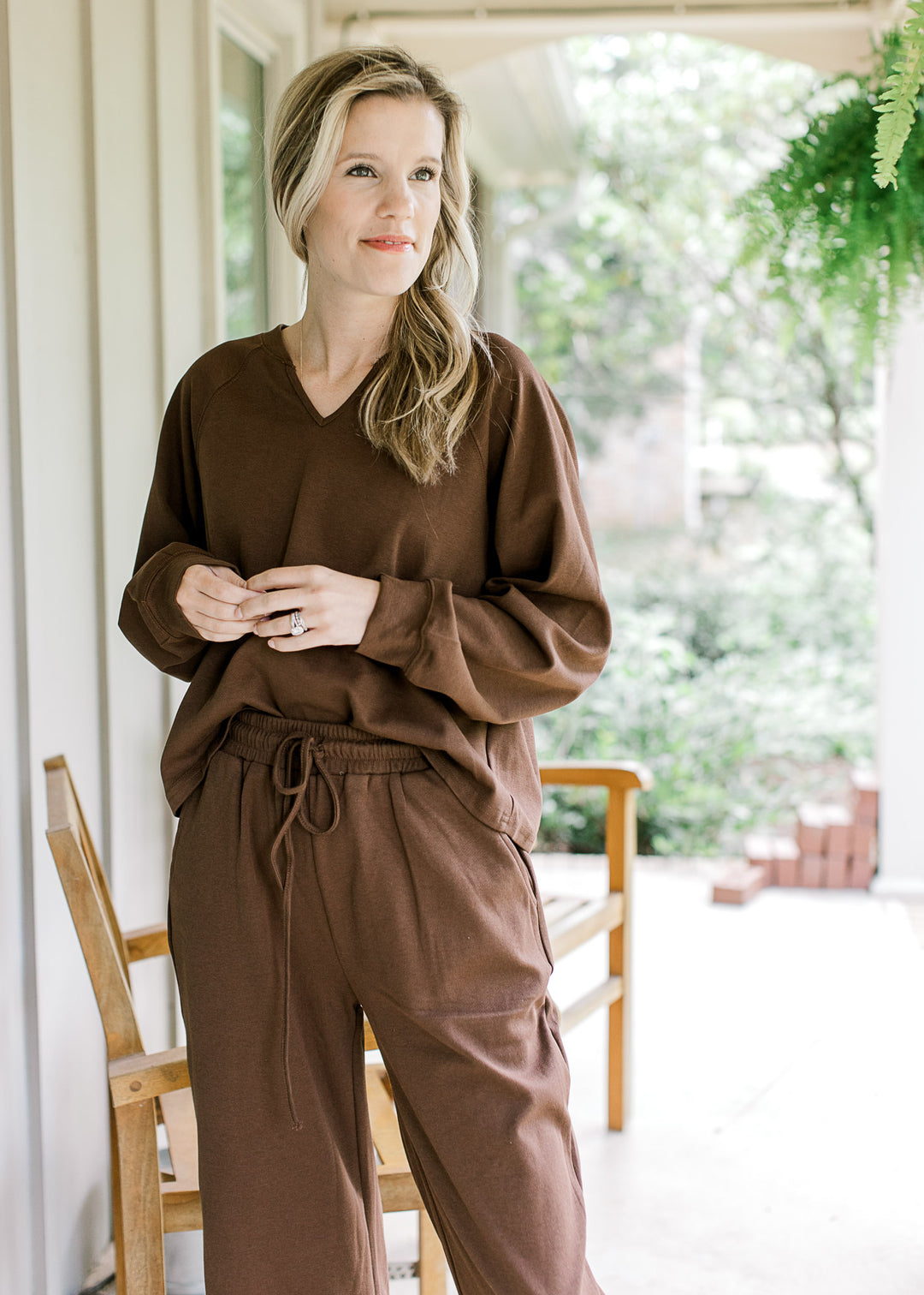Model wearing a matching mocha set, bottoms have elastic band and top is long sleeve. 