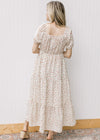 Back view of square neck and bubble short sleeves on a cream maxi with pink ditsy flowers. 