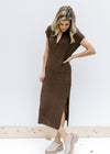 Model wearing mules with a brown, fully lined, knit midi with short sleeves and a v-neck. 