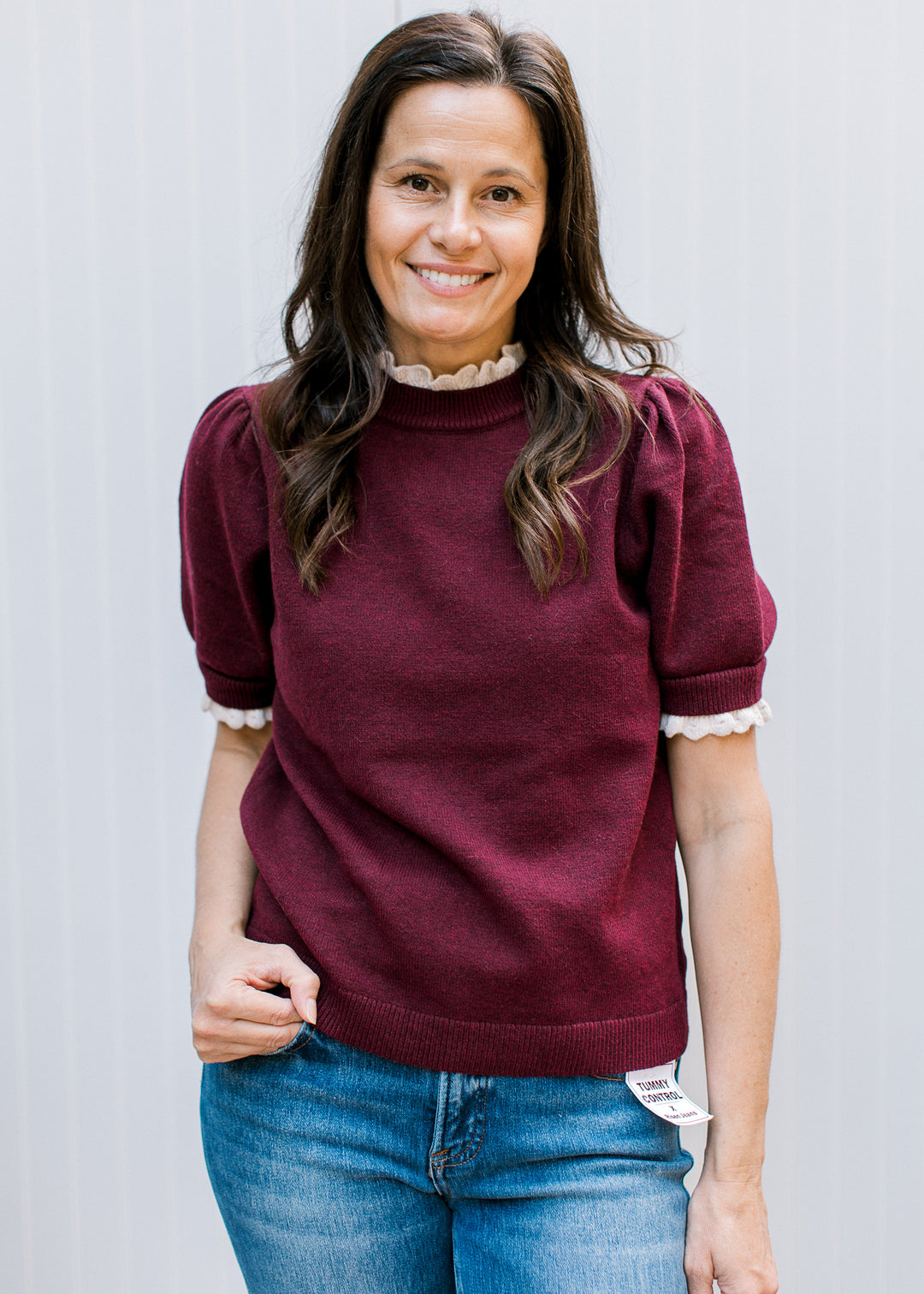 Front view of Burgundy Crochet Layer Top with cream scalloped mock neck trim, short puff sleeves and ribbed hem.