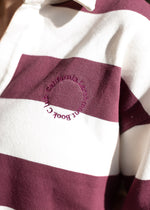 Close up of "California Larchmont Book Club" monogram on burgundy and cream stripes. 