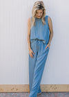 Model wearing a chambray set with a slightly cropped sleeveless top and wide leg bottoms.