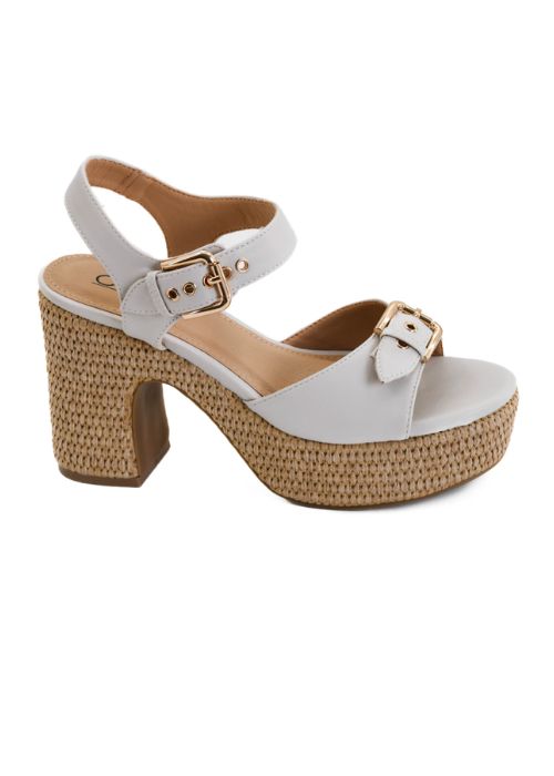 Side view of ivory 4" wedges with brown woven bottom, 1.5" platform and gold buckle closure.
