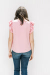 Back view of Model wearing a polyester pink v-neck top with tiered ruffle short sleeves. 