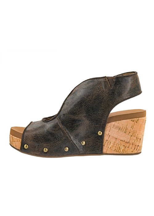 Inside view of an expresso colored wedge with an open-toe design and adjustable ankle straps.