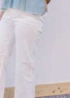 Close up of side slots pockets on white high rise pants with wide leg fit and slight stretch. 