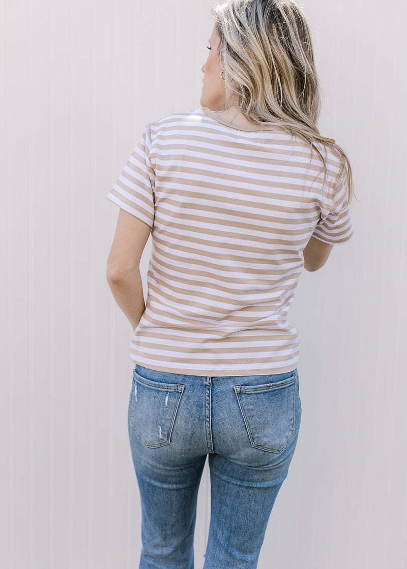 Back view of Model wearing a white tee with khaki stripes, short sleeves and a crew neck fit. 