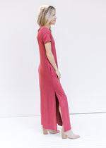 Side view of split side hem on a soft maroon maxi with short sleeves and a v-neck. 