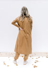 Back view of a mocha long cardigan with long sleeves over a matching sleeveless jumpsuit. 