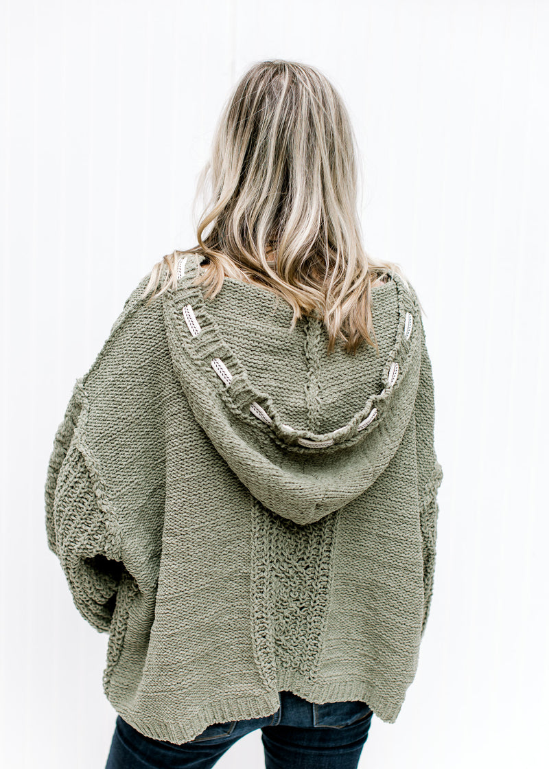 Back view of moss hoodie with long sleeves and a woven white string detail along the hood. 