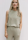 Close up of sleeveless top on a light olive knit set with wide leg bottoms.