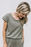 Close up of olive top with a round neck and cuff sleeves with matching wide leg pants.