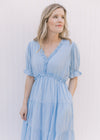 Close up of ruffles at neck and waist on a pale blue midi with poet short sleeves.
