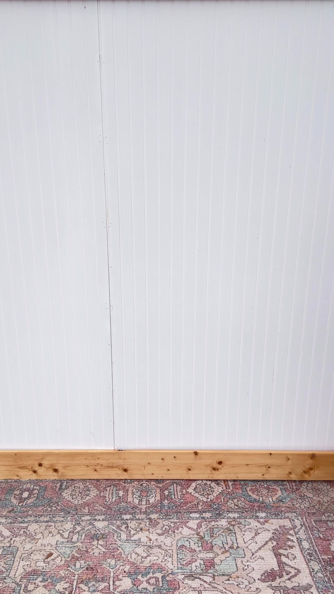 Video of Model wearing a light denim midi with front pouch pockets, side zipper and adjustable straps.