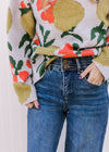 Model wearing medium/dark wash, wide leg jeans with two button closure and elastic in waist.
