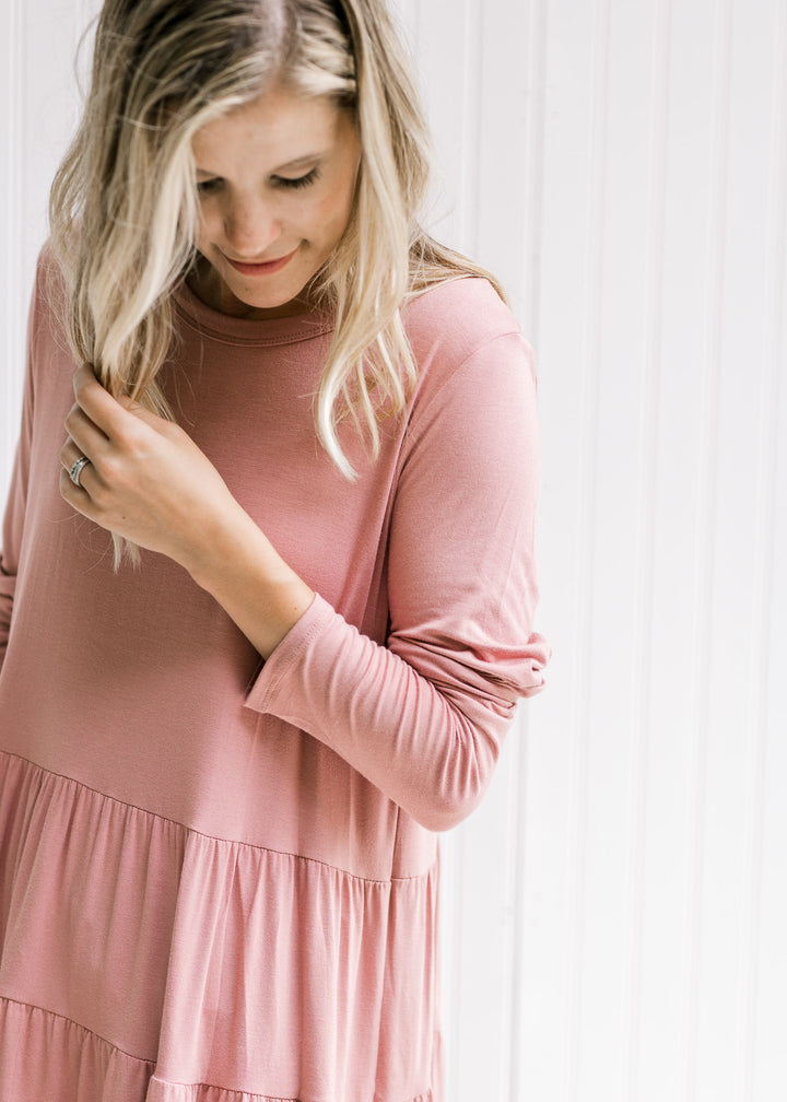 Close up of long sleeves and tiered design on a long sleeve bamboo top with a round neck. 