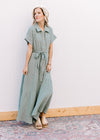 Model wearing sandals and a short sleeve sage maxi with gauze material and a button front.