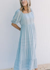 Model wearing a seafoam colored maxi dress with a round neck and bubble short sleeves. 