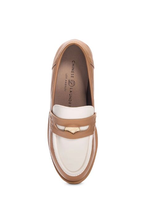 Top down view of a taupe and almond loafer with a flat block heel and coin detail. 