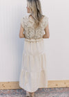 Back view of Model wearing a taupe maxi with a lined crochet top and capped sleeves. 